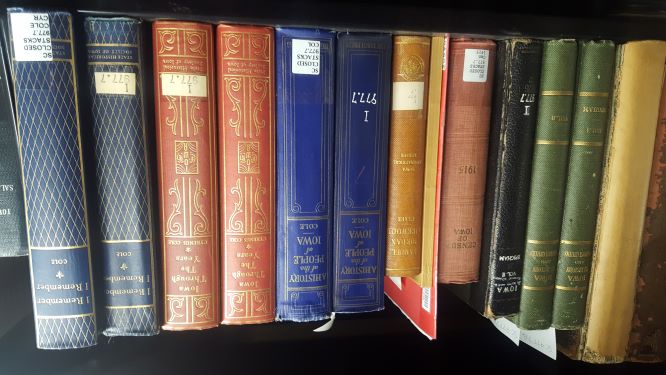A selection of Special Collections volumes, on a shelf.