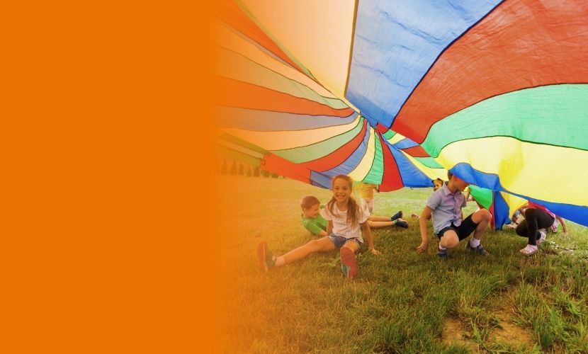 Image of children playing with parachute